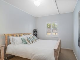 A bedroom with a bed and bedside table at The Old Barn in Manchester