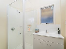 A bathroom with shower and sink at 