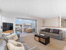 A living room with a sofa and tv at a property