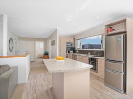A kitchen with appliances and a countertop at a property