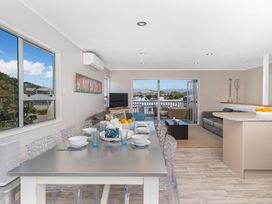 A dining room with a table set for meals at a modern property