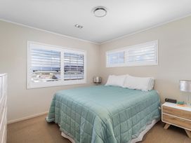 A bedroom with a bed and nightstand at the property in 