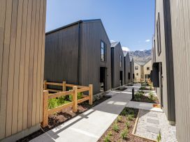 An outdoor area with buildings and a pathway at Pinnacle Peaks - Queenstown Holiday Home in Queenstown