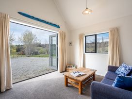 A living room with a sofa and coffee table at the property in an outdoor setting