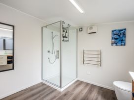 A bathroom with a shower and toilet at the property