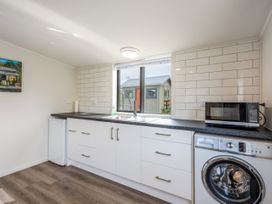 A kitchen with a sink and appliances at 