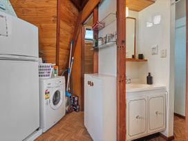 A laundry room with a washing machine and refrigerator at the property in the location