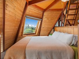 A bedroom with a window and bed at the property 