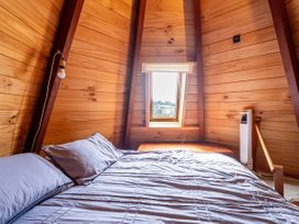 A bedroom with a bed and window at the property