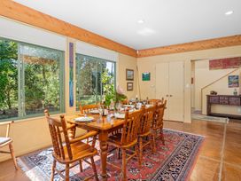 A dining room with a table and chairs at 