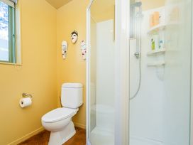 A bathroom with a toilet and shower at 