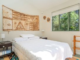 A bedroom with a bed and nightstand at 