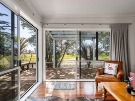 A living room with a sofa and table at the property