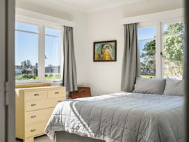 A bedroom with a bed and windows at 