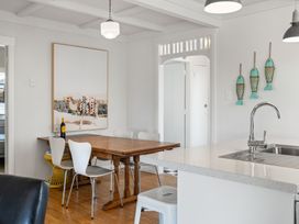 A kitchen with a dining table and chairs at the property in the location