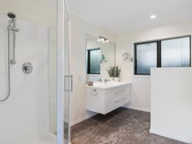 A bathroom with a shower and sink at Nukuhau Bliss - Taupo Holiday Home Taupo Central
