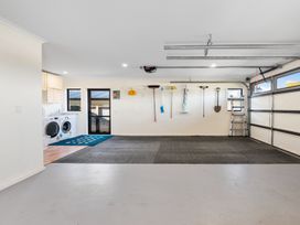 A garage with washing machine and dryer at Nukuhau Bliss - Taupo Holiday Home Taupo Central