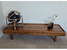 A wooden table with a globe and a decorative object at Nukuhau Bliss - Taupo Holiday Home Taupo Central
