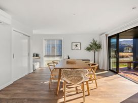A dining room with a table and chairs at Harper on Hadley - Cromwell Holiday Home Cromwell
