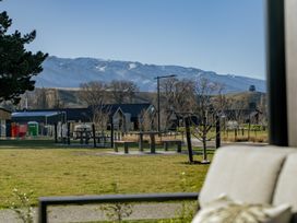 A view of houses and mountains from a park at Harper on Hadley - Cromwell