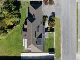 An aerial view of a house with a garden and surrounding pathway at Picton Holiday Home 