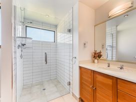 A bathroom with a shower and sink at Picton Holiday Home