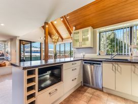 A kitchen with countertops and cabinets at Picton Holiday Home