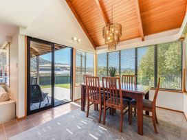 A dining room with a table and chairs at Picton Holiday Home