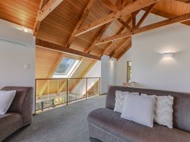 A living room with a sofa and skylight at Picton Holiday Home