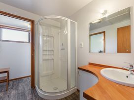 A bathroom featuring a shower and sink at Picton Holiday Home