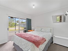 A bedroom with a bed and window at the property in New Zealand
