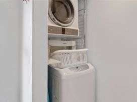 A laundry area with a washing machine and dryer at 