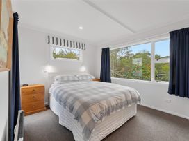 A bedroom with a bed and nightstand at The Old Barn in Manchester