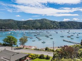 A view of boats on water with mountains in the background at Waikawa Holiday Home