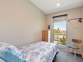 A bedroom with a bed and a window at Waikawa Holiday Home