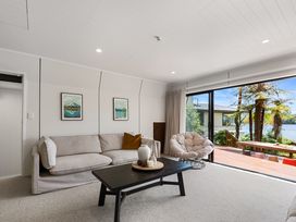 A living room with a sofa and coffee table at Rotorua