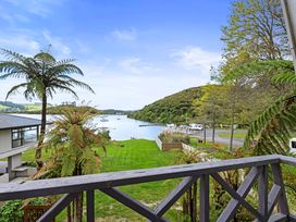 A view of water and hills with trees from a property in Rotorua