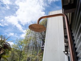 An outdoor shower head with water at Rotorua