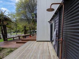 An outdoor area with a shower and wooden deck at Rotorua