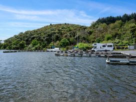 A dock with vehicles near water at Rotorua