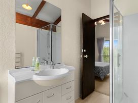 A bathroom with a vanity and shower at Snells Beach