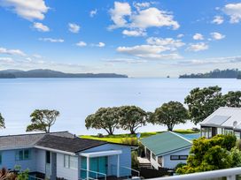 A view of water and houses at Snells Beach