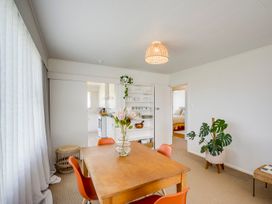 A dining room with a table and chairs at Havelock North Holiday Home