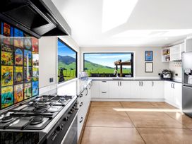 A kitchen with a stove and refrigerator at the property