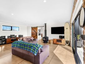 A living room with audio speakers and a television at the property