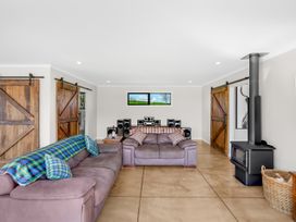 A living room with a sofa and sound system at the property in location