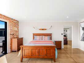 A bedroom with a bed and furniture at the property