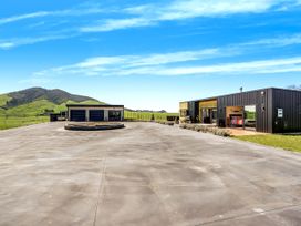 An outdoor area with a modern building and circular patio at an undisclosed location