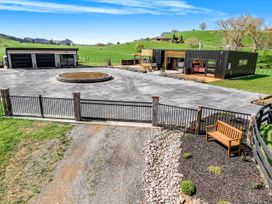An outdoor area with a house and garage at a property