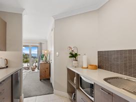 A kitchen with a microwave and kettle at Red Beach Retreat - Whangaparaoa Peninsula